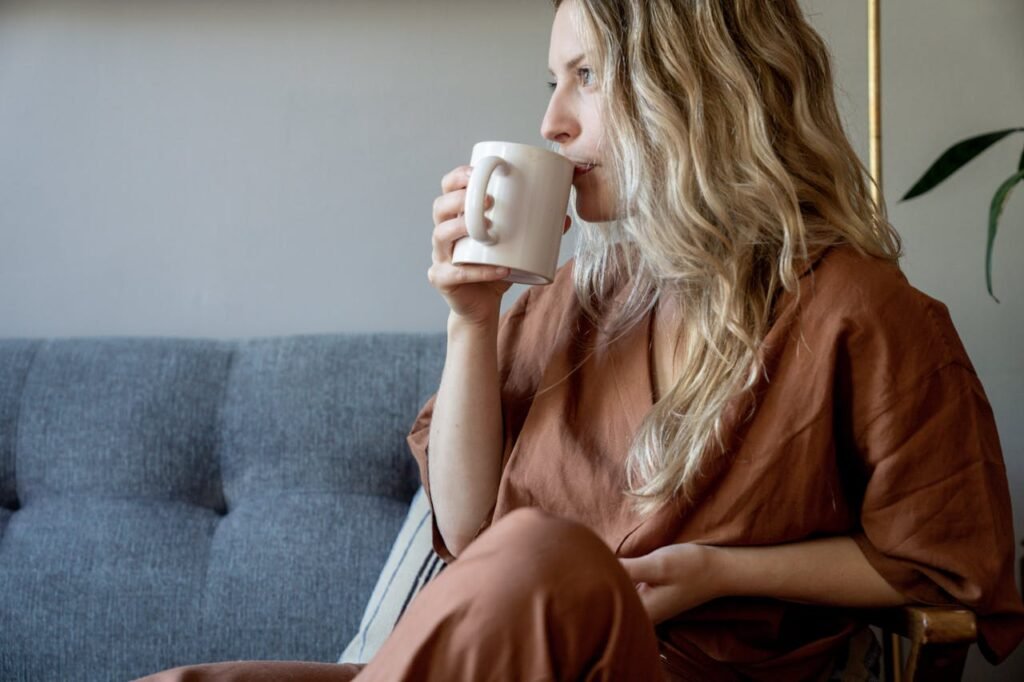 woman sipping coffee home decor in monsoons